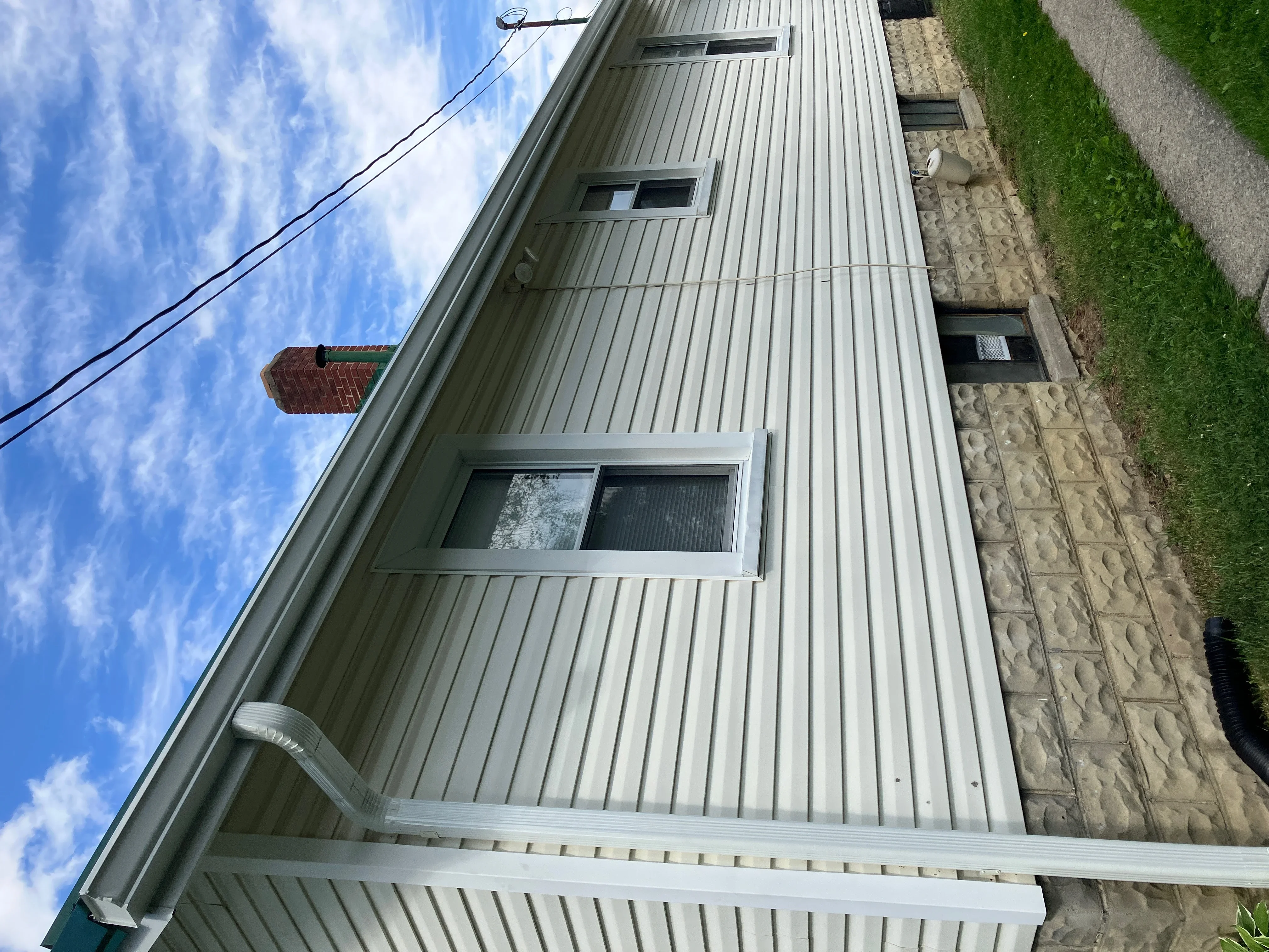 White aluminum gutter system with soffit and fascia on residential home exterior